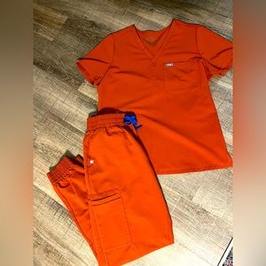 FIGS Scrub set, burnt orange with royal blue accents. Worn only a few times.